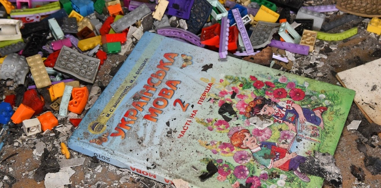 Ukrainian Children's Book on top of rubble