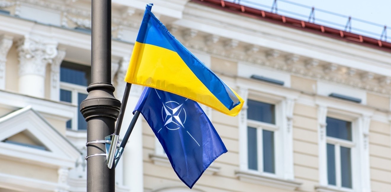 NATO and Ukraine Flags on pole