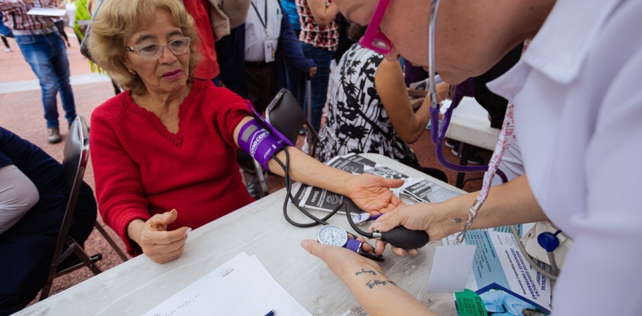 ypertension in Older Age. Young Female Medical Worker Measuring Blood Pressure, Patient.