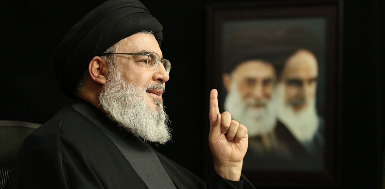 Nasrallah with Khamenei and Khomeini photo