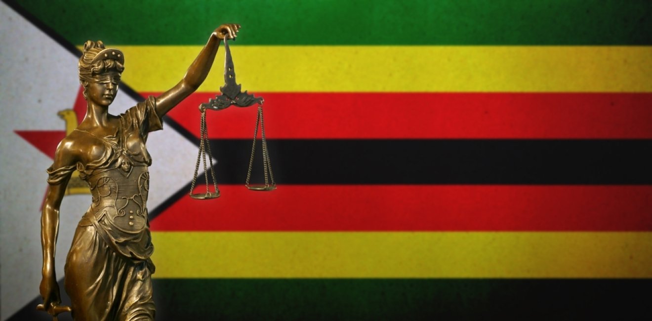 Symbol of Lady Justice and Flag of Zimbabwe