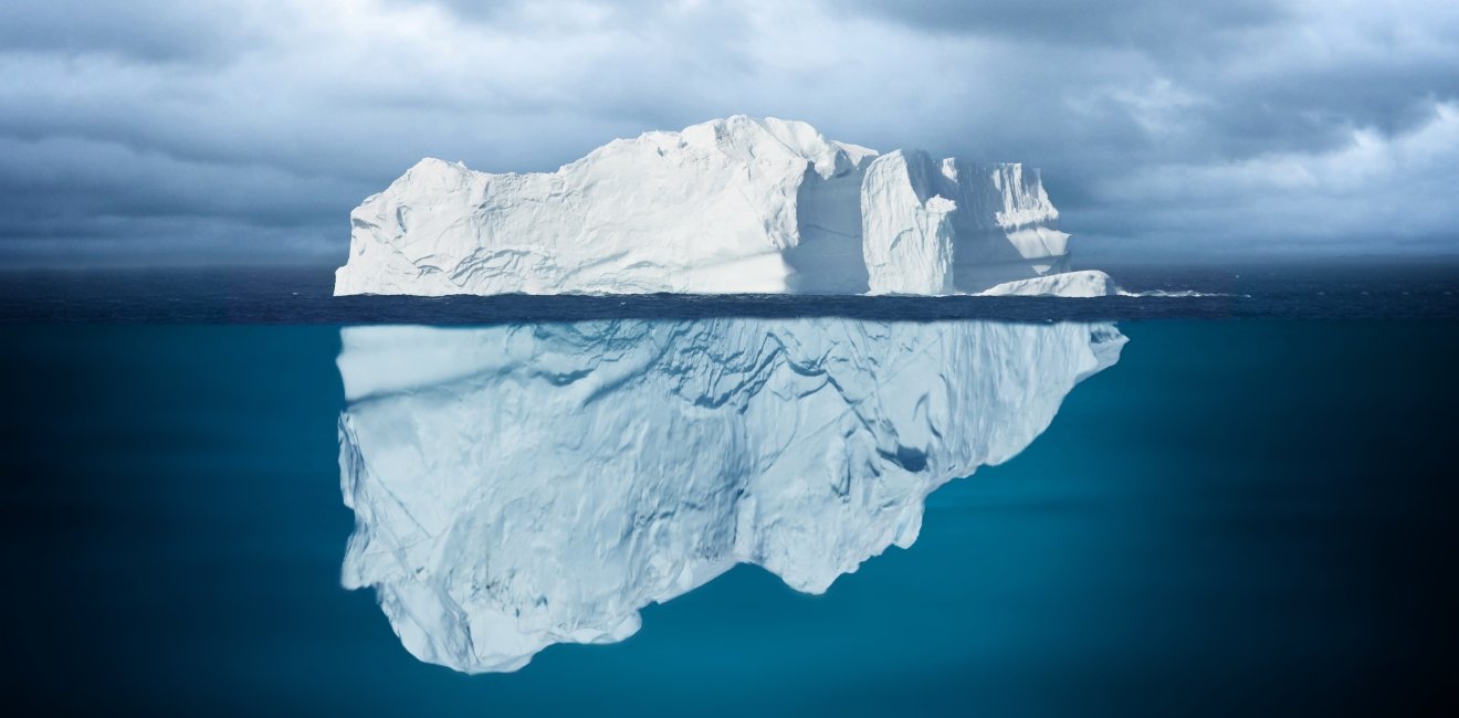 Iceberg Mostly Underwater Floating in Ocean