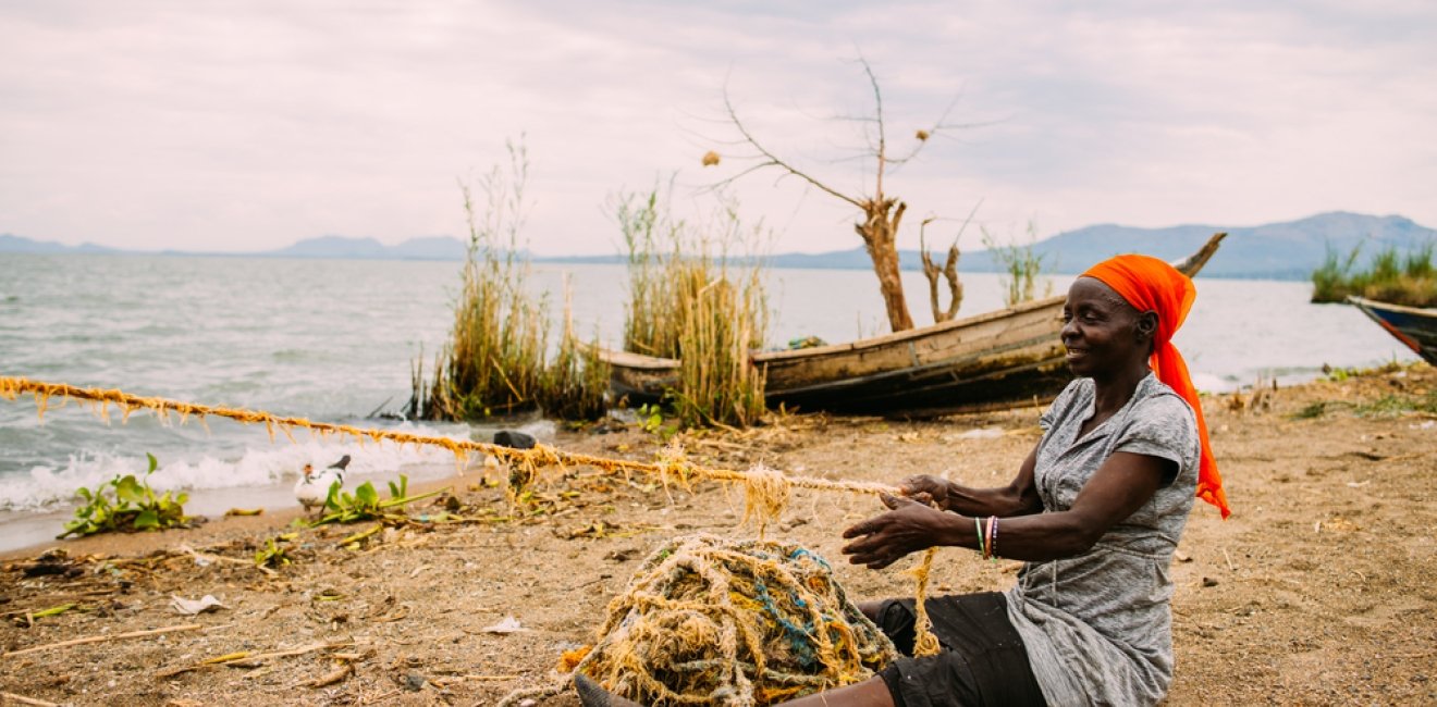 A woman fishing near Lake Victoria