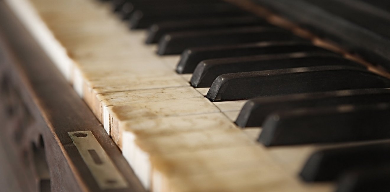 Old piano with faded keys