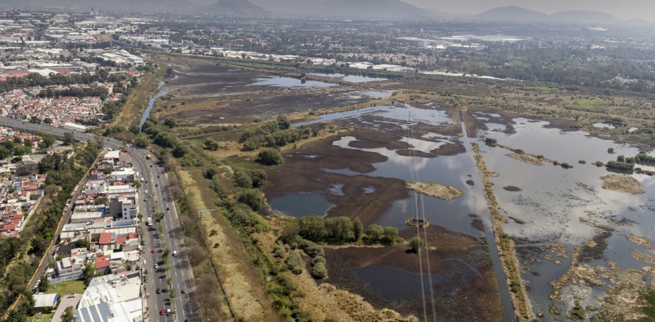 Aerial view of water regulation pond in the urban area of Mexico City