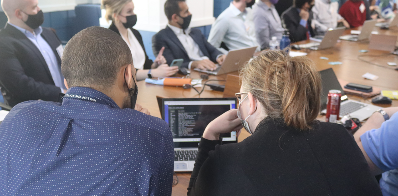 Two tech labs participants sharing a computer screen