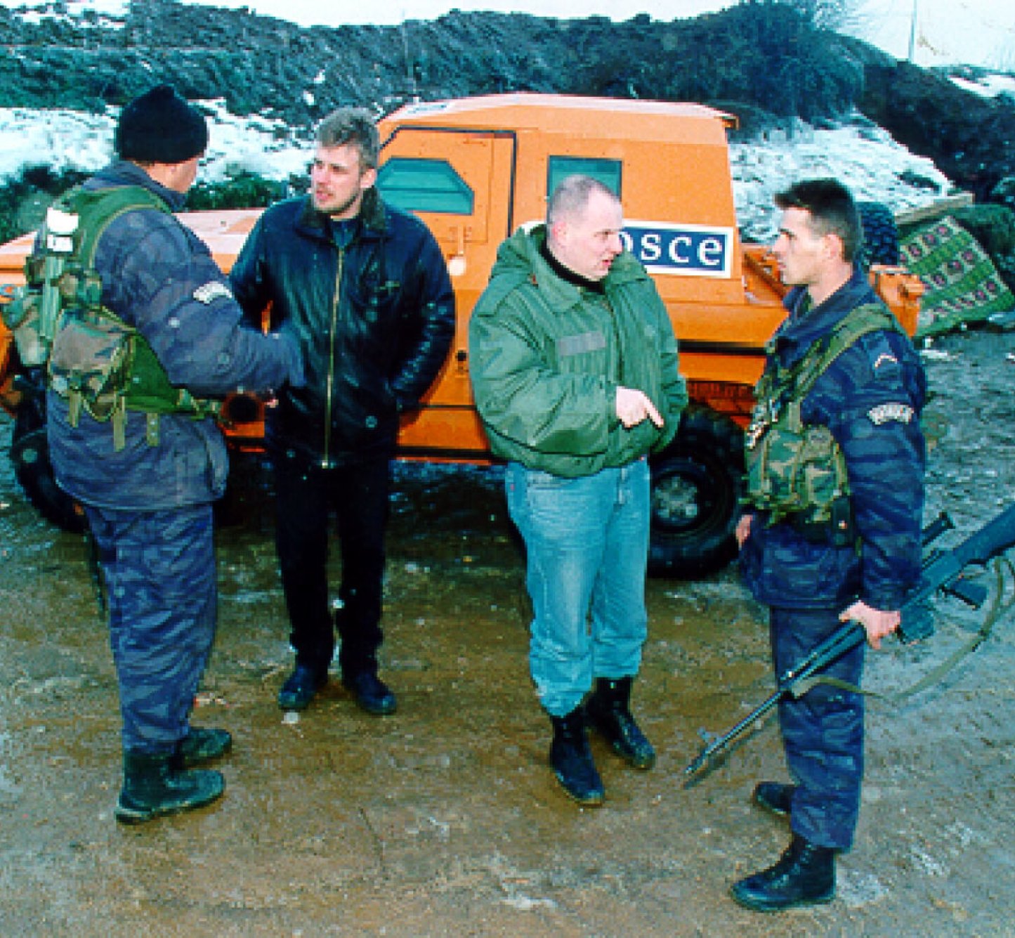 Unarmed OSCE members of the Kosovo Verification Mission take steps in Kosovo to maintain the ceasefire, November 1998