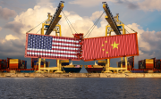 Shipping containers with the US and Chinese flag collide