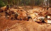 Assafo, Ivory Coast - April 3, 2024: children feeding a crusher with ore to extract some grams of gold. In Ivory Coast, children from Burkina Faso often provide cheap manpower for local businessmen