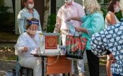 In Petrozavodsk, Russia, voting continues on  the adoption of amendments to the Constitution. Part of the voting takes place at improvised street polling stations, with poll workers wearing masks.