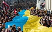 parade with large ukraine flag