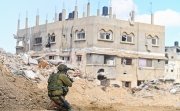 Han Yunis - Feb 7th 2024, Gaza stip. An IDF infantry commando soldier is covering towards ruin building.