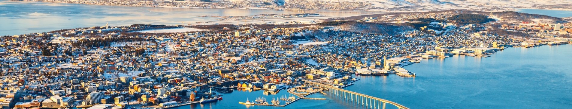 Above view of beautiful winter landscape of snow covered town Tromsoe in Northern Norway