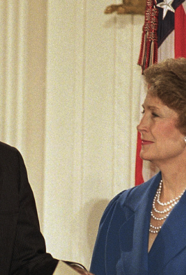 Susan Baker smiles at her husband, James Baker III, as he is sworn in as Secretary of State at the White House in Washington on Friday, Jan. 28, 1989 during a reenactment of the ceremony. Chief Justice William Rehnquist swears Baker in, second from right as President George H. Bush looks on, right. Baker was officially sworn in a private ceremony on Wednesday at the State Department. 