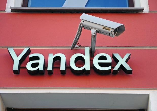 Yandex city store facade and logo accompanied by a surveillance camera