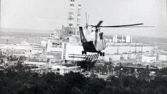 Image: A helicopter sprays a decontamination liquid nearby the Chernobyl reactor in 1986. Source: IAEA Imagebank #02790036, via Wikimedia Commons, CC BY-SA 2.0.