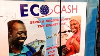 A stand selling phone credit in Zimbabwe, with ads for mobile money. Zimbabwe has shut down internet access in response to protests. Photo by Kay McGowan, USAID, via Flickr. Creative Commons.