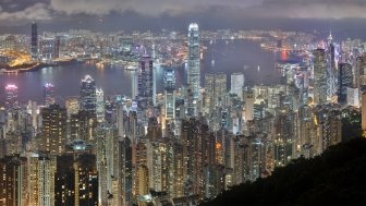 A panorama of the Hong Kong Island and Kowloon skyline at night,