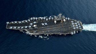 A U.S. aircraft carrier travels through the Malacca Straits.