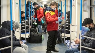 Health workers on a Moscow subway car.