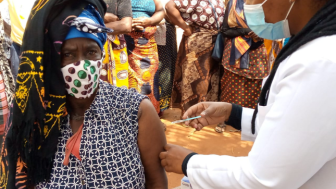 Woman receives vaccination in Mozambique.