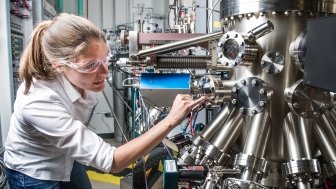 NREL scientist uses a Compound Semiconductor Molecular Beam Epitaxy System