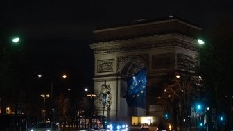 EU flag flying under the Arc de Triomphe