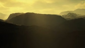 An image of mountains with a yellow sky