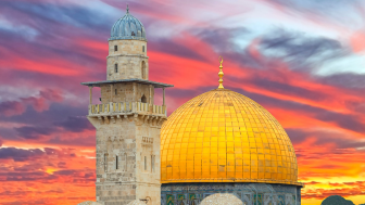 Sunrise above golden dome of Rock Mosque on Temple Mount in old city of Jerusalem.