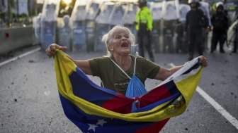 Protesters demonstrate against the official election results declaring President Nicolas Maduro's reelection in Valencia, Venezuela, Monday, July 29, 2024, the day after the vote.