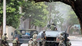 Soldiers huddled in Michoacan.