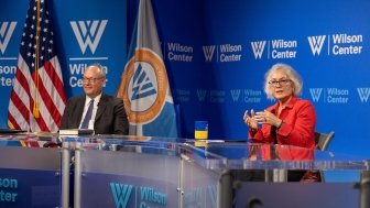 Marie Yovanovitch sits in front of Wilson Center branding