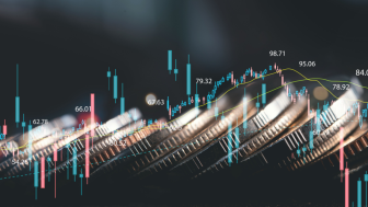 Financial chart trending upward with coins in the background