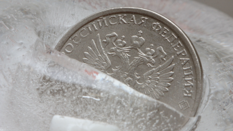 Russian coin frozen in ice block