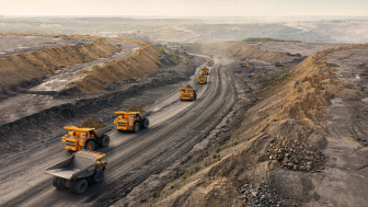 Dump trucks leaving a quarry