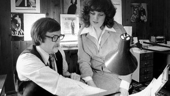 Black and White photo of man and woman in studio