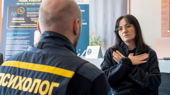 An instructor teaches a relaxation technique during a training session in Kyiv. Participants included psychologists from Ukraine’s State Emergency Services. Courtesy International Medical Corps, used with permission.