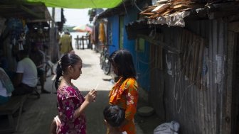 Bangladeshi children stand outside in Barisal.