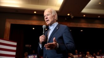 Joe Biden Talking into a Microphone at a campaign event 