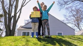 Children holding a sign of we are citizen scientists