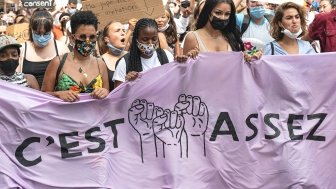 image - women protesting holding sign