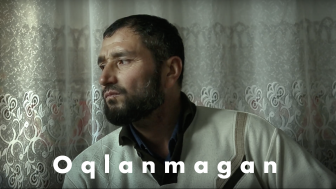 still from film Oqlanmagan with title overlaid