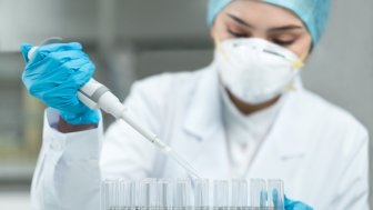 Young female scientist working in the laboratory