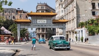 Barrio chino, gate in Havana, Cuba. Havana Cityscape with Local Vehicles, Architecture and People. Cuba. China Gate