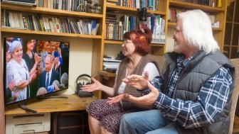 Russian pensioners watch Vladimir Putin's 2018 presidential inauguration on television