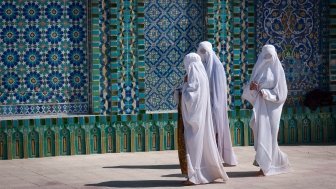 Women in burqas at a mosque