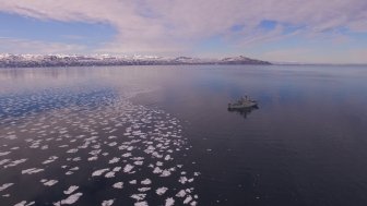 Photo of a ship sailing near ice