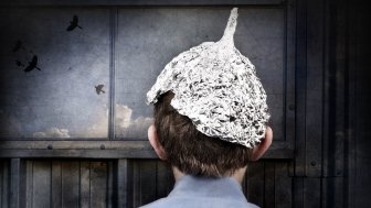 Young person wearing a tin foil hat