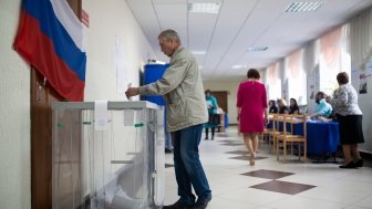 Tyumen, 2018: Photo of a man casting a ballot in a Russian eleciton