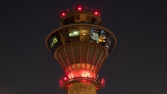 NavCanada Control Tower at Toronto Pearson International Airport (YYZ) as seen in the evening sky on a clear night.